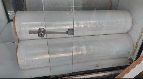 CLEAR CELLOPHANE WRAPPING PAPER ROLL.