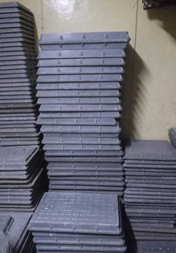 FIBER MANHOLE COVERS.