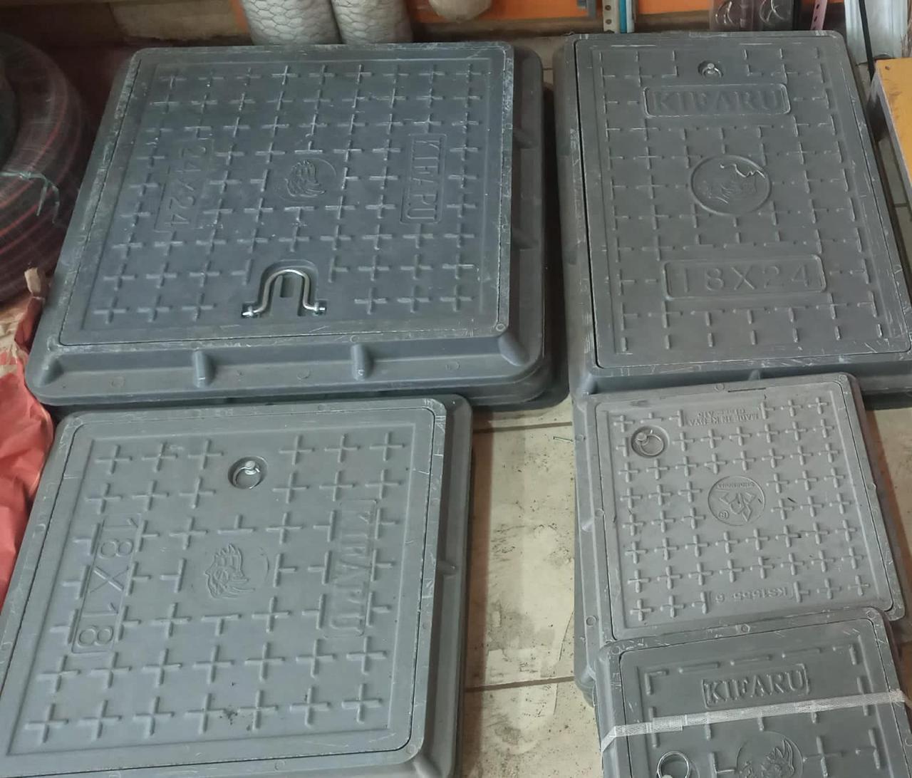 FIBER MANHOLE COVERS.
